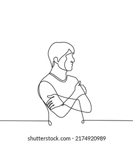 man stands with his hands hugging his shoulders - one line drawing vector. male profile portrait. the concept of self-rescue, self-complacency, insecurity, cold