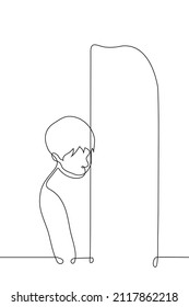 Man Stands Looking Out From Behind The Door - One Line Drawing Vector. Concept Peep, Hide, Introvert, Shy Person