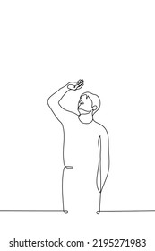 man stands looking at the sun through his fingers - one line drawing vector. concept look at the sun, bright sun, heat, summer, solar eclipse