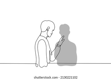 man stands near the wall and touches his shadow - one line drawing vector. the concept of self-reflection, self-knowledge,  looking at yourself 