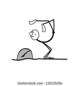 a man stands on his hands, in a pose yoga. close to the stone