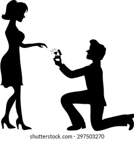 
Man stands on one knee and offers the woman to marry him