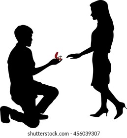 Man stands on one knee and offers the woman to marry him, Will You Marry Me?