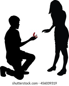 Man stands on one knee and offers the woman to marry him, Will You Marry Me?