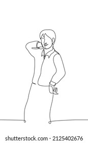 man stands playfully smiling and posing - one line drawing vector. concept posing for photo, male fashion model in shirt, man tempt 
