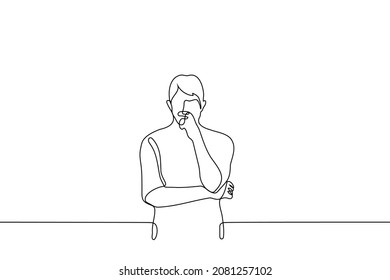 man stands tensely thinking he crossed his arms with one hand to his face - one line drawing vector. concept of brainstorming, intelligent person ponders, make a decision, reflection 