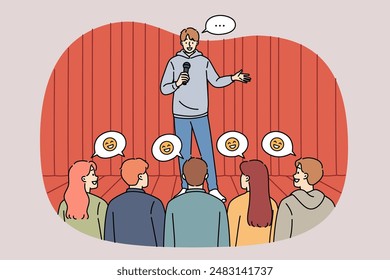 Man stand-up comedian performs in front of audience, telling jokes from stage and making people laugh. Guy works as comedian and cheers up men or women who attended comedy concert.