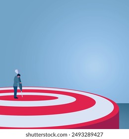 A man sticks a small dart over a large target, an illustration of dreaming big.