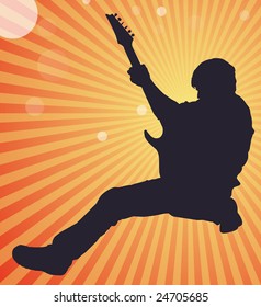 Man striking rock n' roll pose with electric guitar and sunburst background