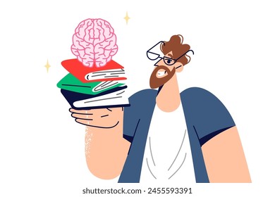 Man student studies from books to prepare for exams at university, holds textbooks and brain in hand. Adult man became student again to improve professional qualifications and gain new knowledge