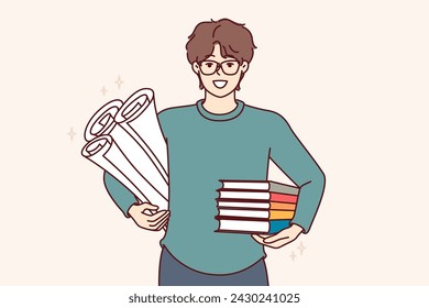 Man student with textbooks and papers for creating engineering drawings, smiles and looks at screen. Guy student studying at university or college holds books recommended by teacher