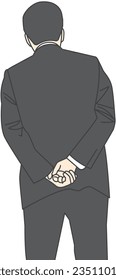 A man in a suit with his hands folded behind his back
