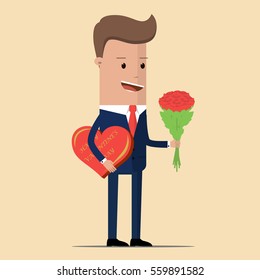 A man in a suit holding a bouquet of flowers and a box of chocolates in a heart shape. Businessman with flowers and hearts