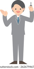 Man in suit holding a key