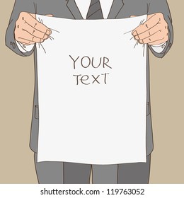 Man in suit holds sheet of paper