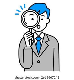 Man in a suit looking through a magnifying glass