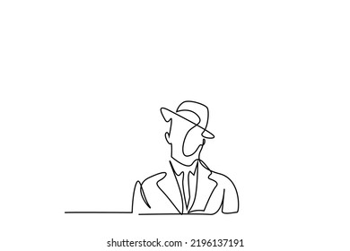 a man in a suit with an old stylish hat stands seriously portrait concept