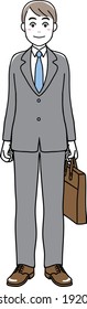 A man in suit standing with a business bag in his hand