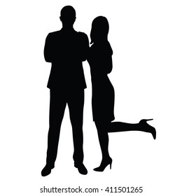 Man in suit standing face with folded arms, sexy woman cuddle up to him, leaning on him. Dominance, leadership, charm, strength, charisma. Couple of young people in formal wear. Business man and woman