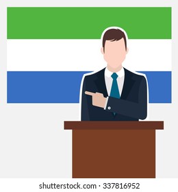 Man in suit standing at rostrum Front of Sierra Leone Country Flag Pointing to the flag. Business man Presentation conference concept. Modern flat design vector background illustration.