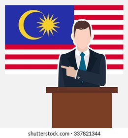 Man in suit standing at rostrum Front of Malaysia Country Flag Pointing to the flag. business man Presentation conference concept. Modern flat design vector background illustration. 
