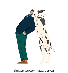 A man in a suit stands with a dog.