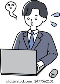 Ein Mann im Anzug im Zustand des Verlassenwerdens vor einem Laptop