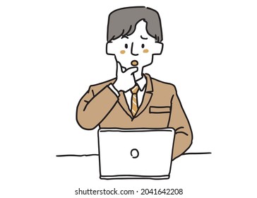 A man in a suit who has doubts about something while working on a computer