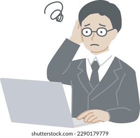 A man in a suit who worries while operating a computer