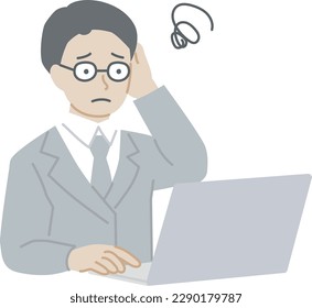 A man in a suit who worries while operating a computer