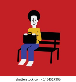 Man suitcase sitting on bench waiting