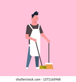 man sweeping floor with broom and scoop guy doing housework house cleaning concept male cartoon character full length flat pink background