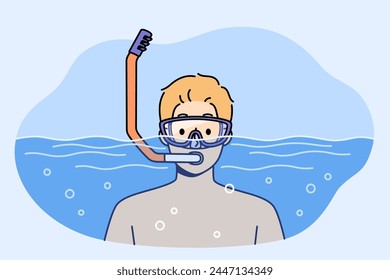 Man swims in pool with goggles and snorkel for breathing underwater during summer holiday at sunny resort. Guy visiting pool is engaged in active recreation and enjoys diving in free time from work.