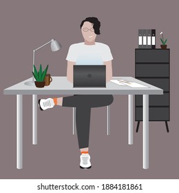 man at the table with laptop at work 