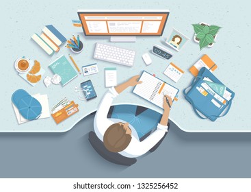 Man takes notes in a notebook at the table. Workplace Desktop Workspace  Armhair, office supplies, monitor, folders, phone, headphones, tea, purse, books, bag. Vector Top view 