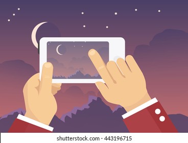 Man taking landscape photo with mobile phone - nigh sky