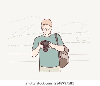  man taking photos with vintage camera outdoor. Hand drawn style vector design illustrations.