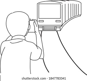 a man taking picture of the train