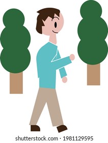 Un hombre caminando entre los árboles verdes