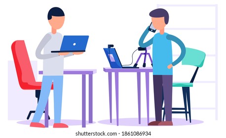 The man is talking on the phone. The guy works on a laptop. People spend time and socialize in a recording studio. Male character with computer in hands at work. Colleagues communicate indoors
