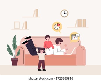 Man telecommuting at home. Laying and working on the couch while taking care of the children. freelancer.