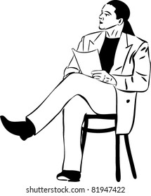 man that is reading while sitting on a wooden chair