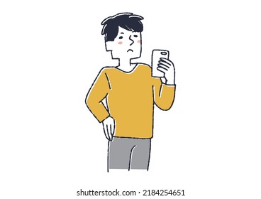 A man thinking while looking at his smartphone