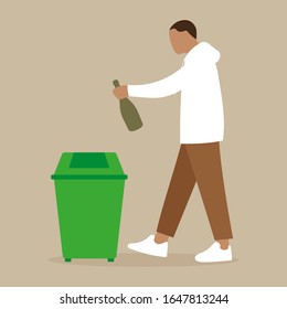 A man throws a bottle into the urn