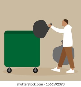 A man throws a garbage bag into a trash can
