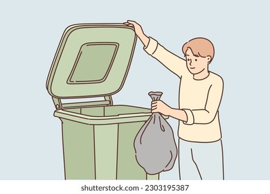 Man throws garbage into large container for concept of overabundance of garbage on planet. Guy stands near trash can and holds black bag refusing to sort waste and take care of environment