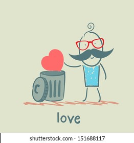 man throws the heart into the bin