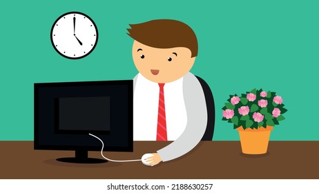 A man in a tie works at a computer at an office desk