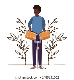 man with timpani and branches and leaves in the background
