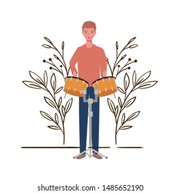 man with timpani and branches and leaves in the background